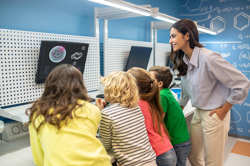 Teacher guiding students in lab
